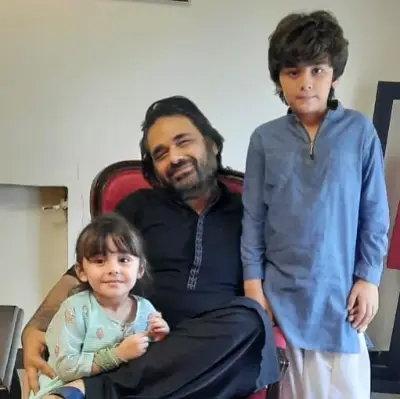 With his son and daughter