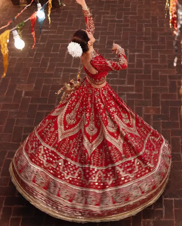 The actress dancing in the bridal dress
