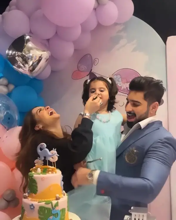 A celebration moment of Amal Muneeb's 3rd birthday with her parents
