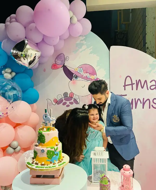 A celebration moment of Amal Muneeb's 3rd birthday with her parents