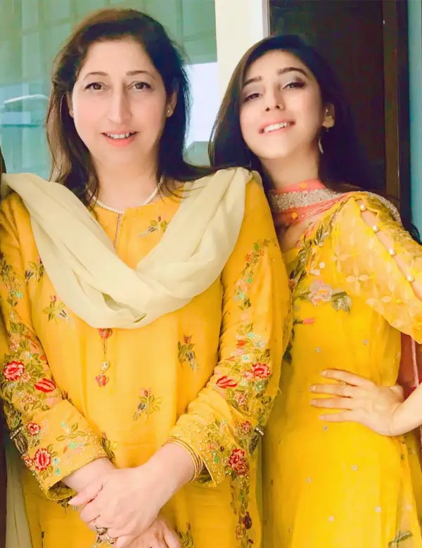 In the same dress, a mother and daughter pair