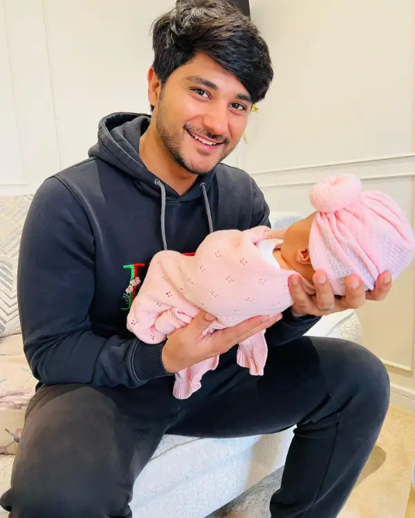 The brother of Maya Ali holds his newborn daughter