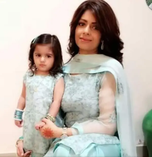 In the photo, Somi Nizami Lodhi is holding her daughter