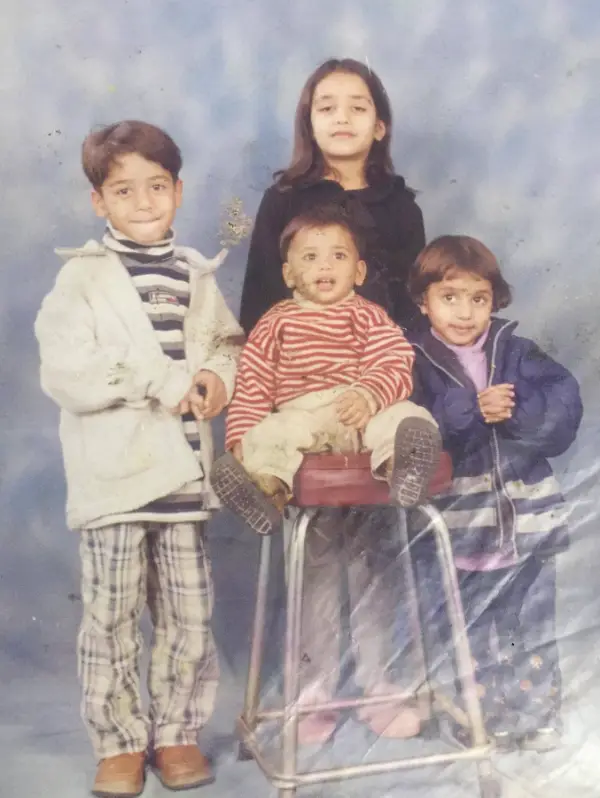 An image showing her with her siblings and parents.