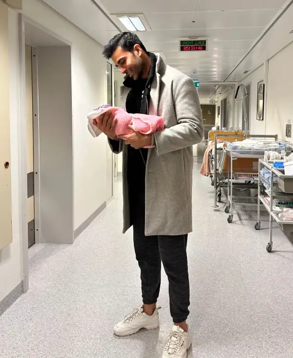 Ali Kureshi and his newborn daughter Frozen