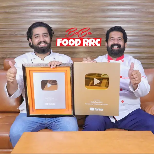 A photo of Pakistani YouTuber BaBa Food RRC with a golden play button in his hand