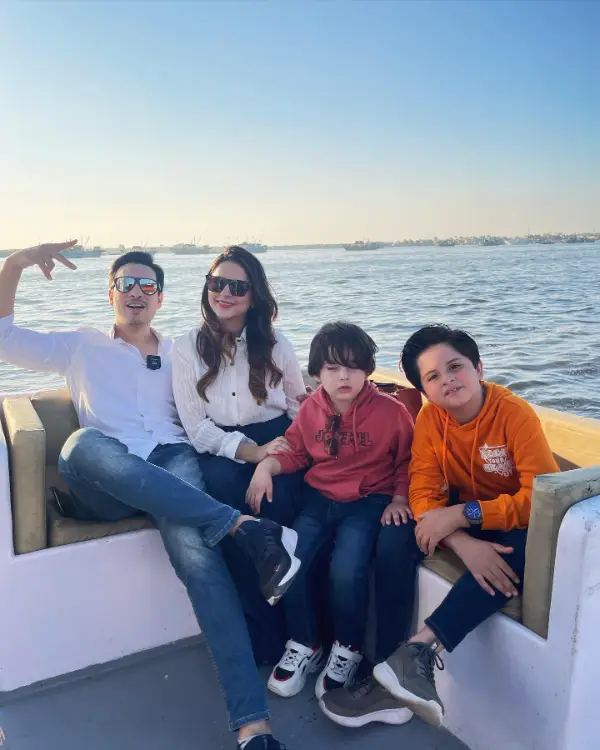 The couple is on a seaboat with their children
