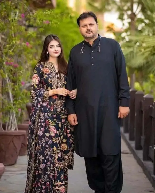 A picture of Muzna Masood and her father