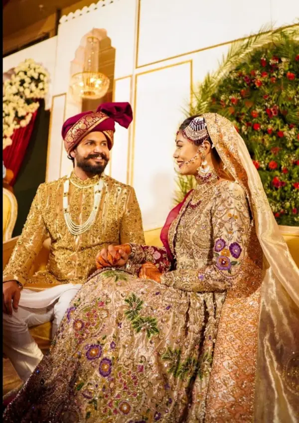 Another wedding picture of Azlan Shah on a sofa with his wife next to him