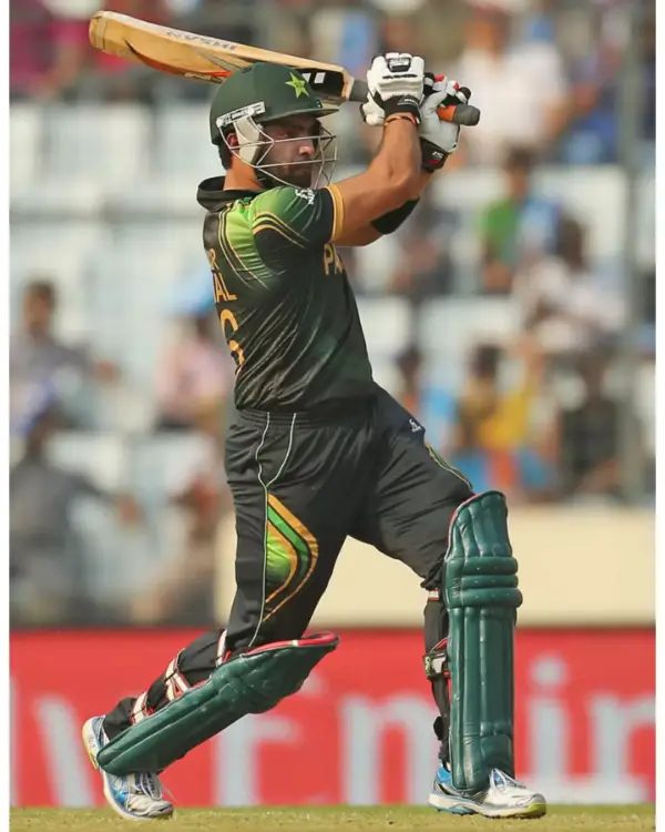  A picture of Umar Akmal in action during the cricket match scoring four runs