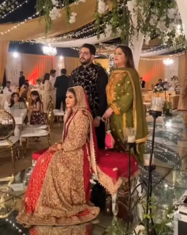 The actress at the wedding reception with her daughter-in-law and son Ahmed Nizamani