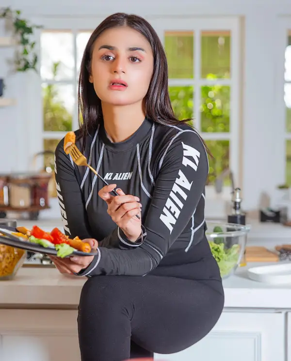 A picture of the actress eating salad while wearing skin tights