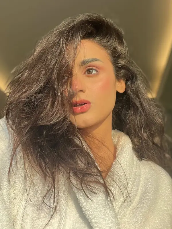 An image of Hira Mani wearing an off-white towel taken in the mirror