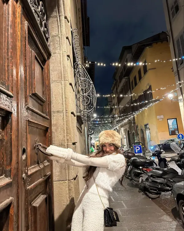 In Italy, Naimal Khawar and Fiza Khawar walk down a street