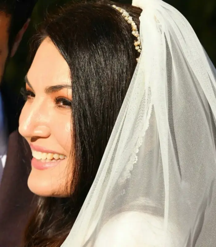 On her special day, Reham Khan poses in a white gown with a bright smile