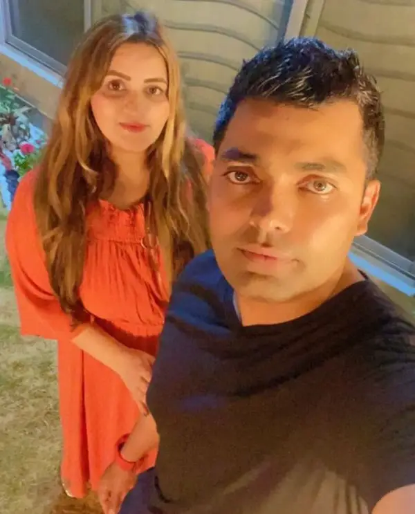 Umar Akmal and his wife take a selfie together at home