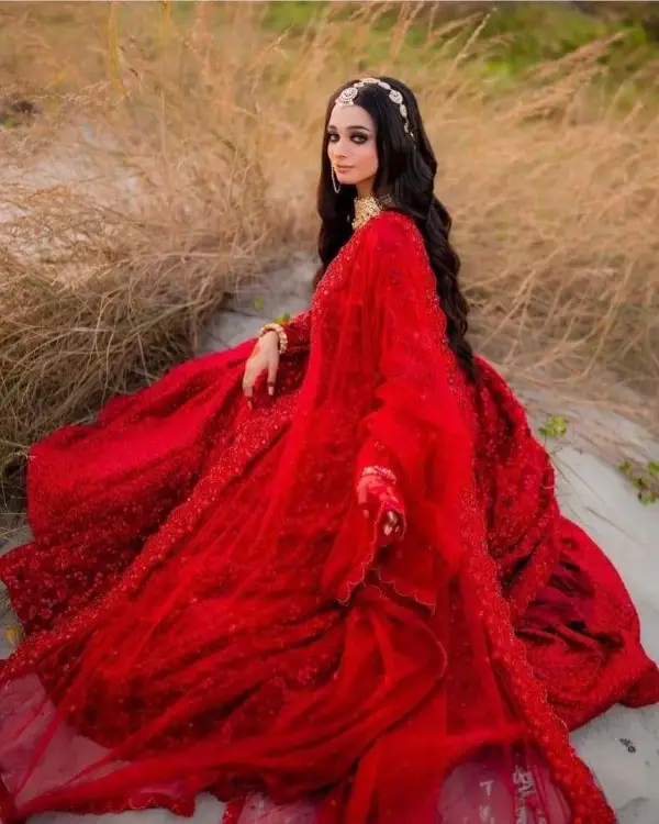 A beautiful picture of the star wearing red bridal dress