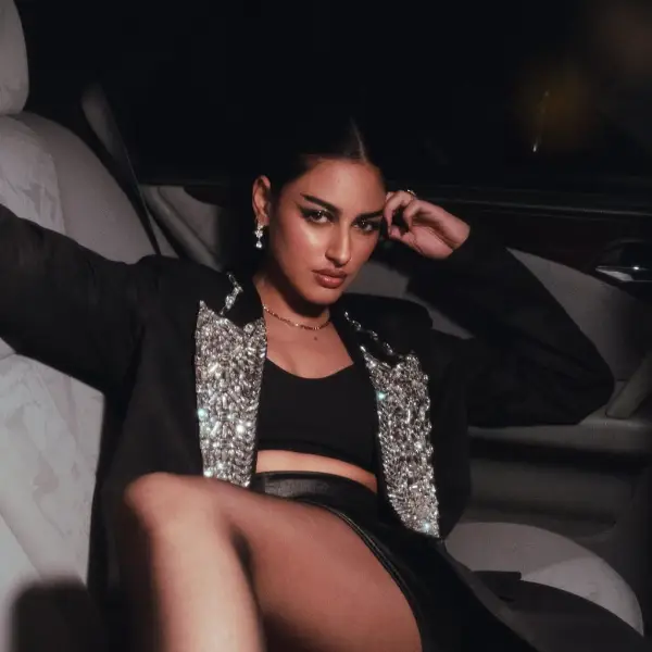 The actress posing in a car during a photo shoot