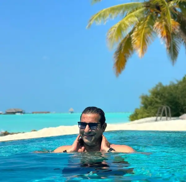 The cricketer enjoys swimming alone in this picture