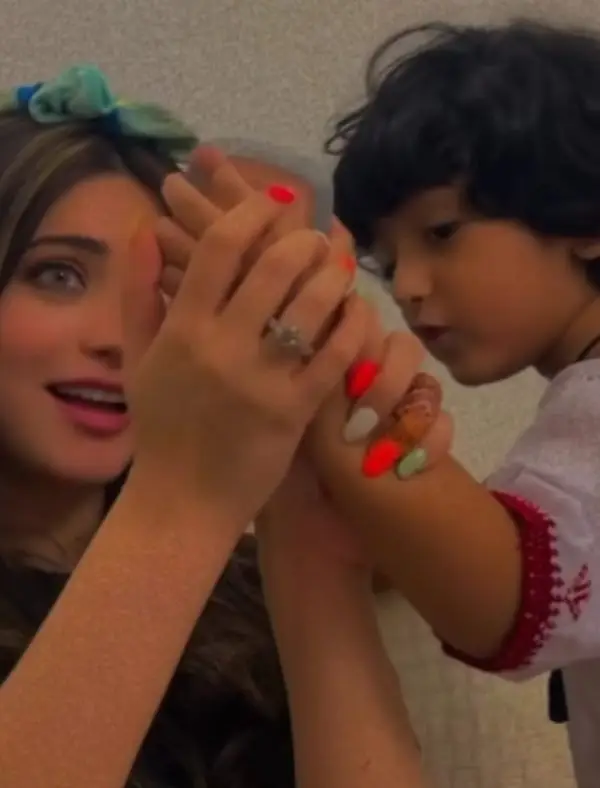 Actress playing with children