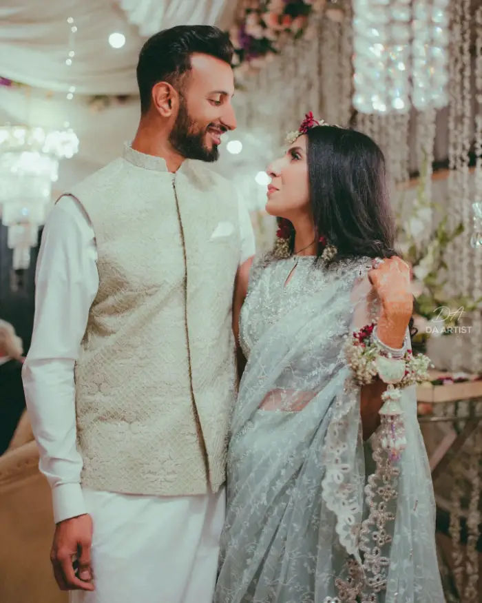 A wedding picture of Shan Masood with his wife Nische Khan looking at each other