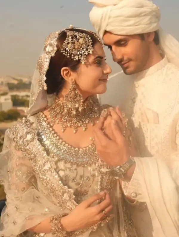 During their wedding shoot, the couple poses together