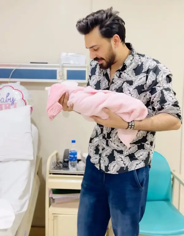 MJ Ahsan with his newborn daughter