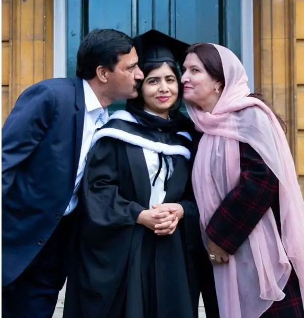 Malala with her father and mother after earning a PPE degree at Oxford