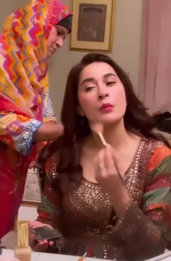 As the actress prepares for the ceremony, she wears makeup