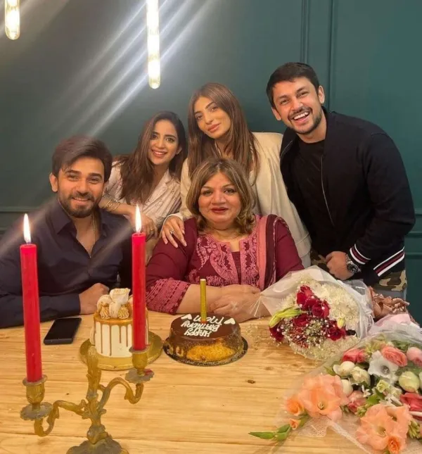 Here is an image of her with her in-laws celebrating her birthday
