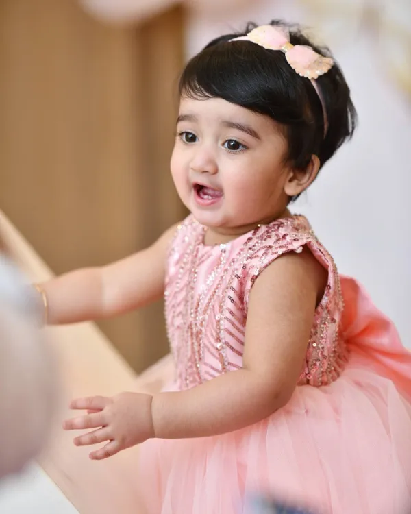 A beautiful picture of baby Izzah wearing pink dress