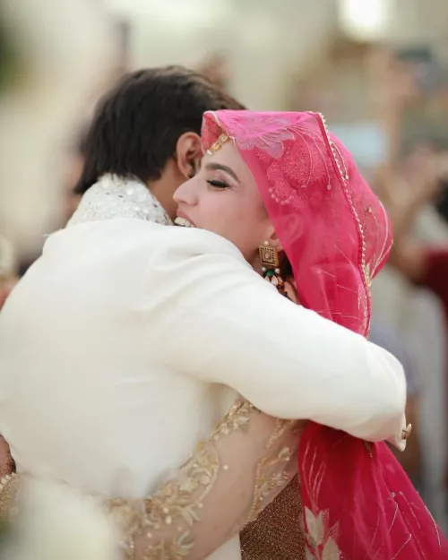 During the wedding ceremony, the bride and groom hugged each other