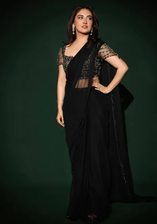 She wore a black saree that revealed a lot of her body
