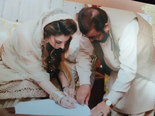 Memoona Qudoos with her father on the day of her wedding