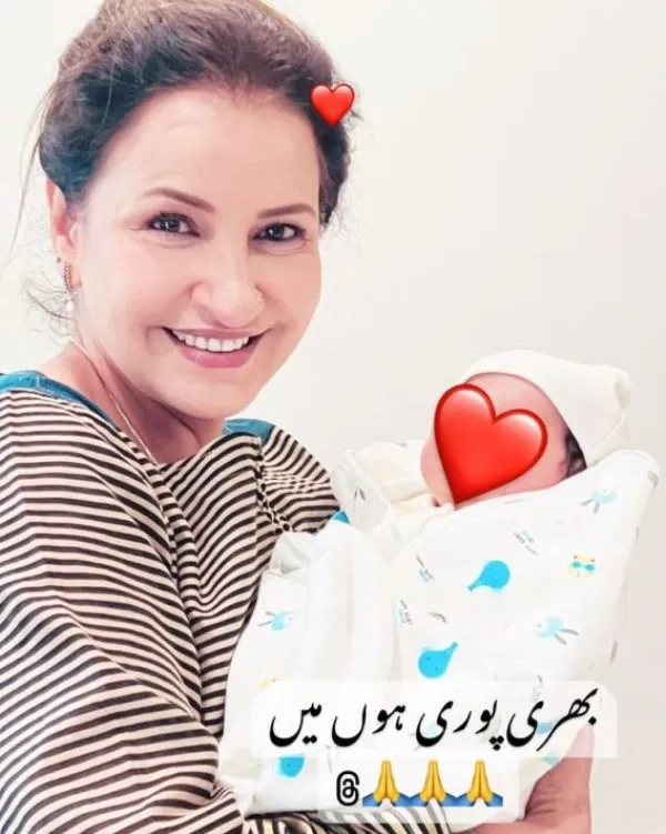 Saba Faisal holding her grandson
